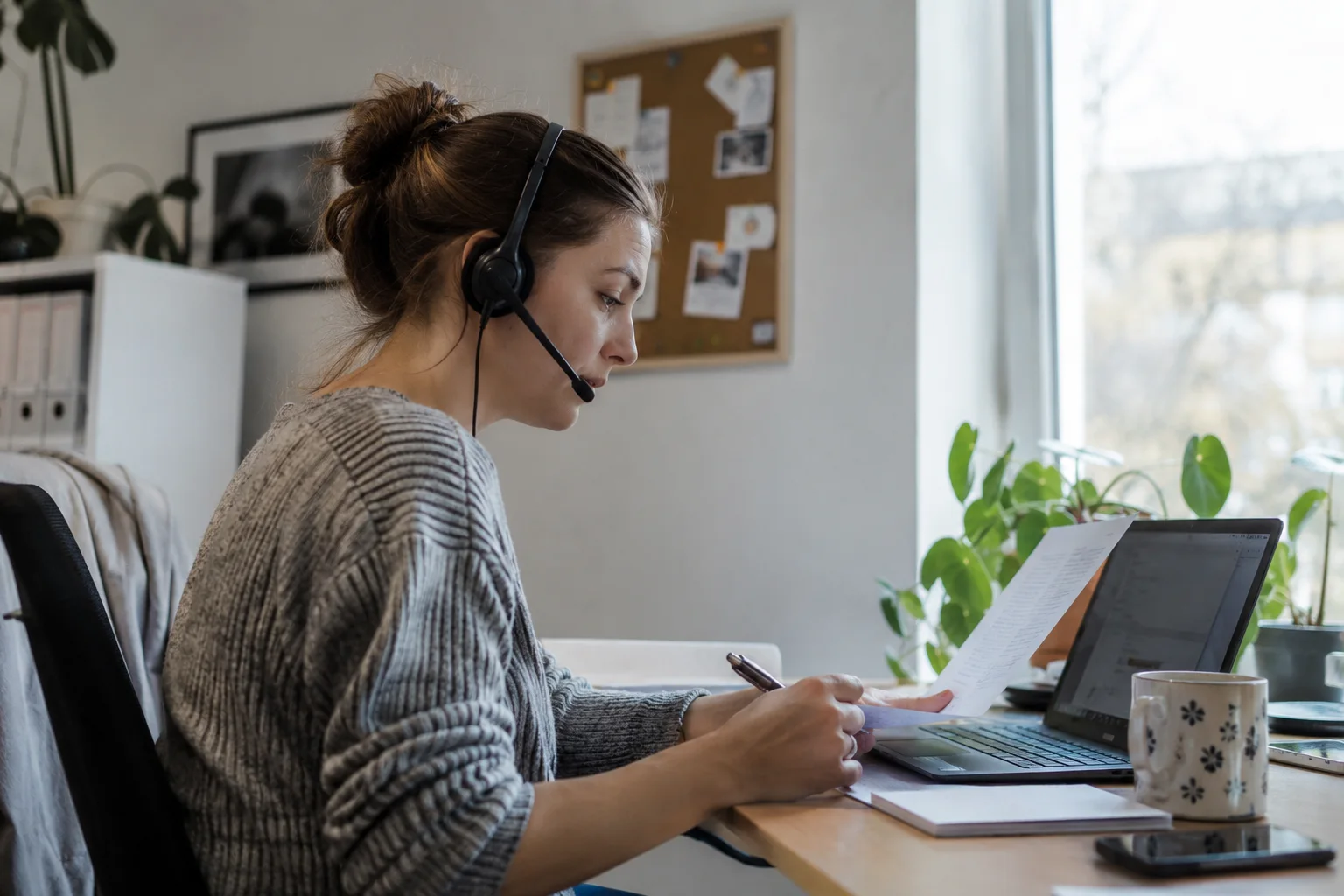 Customer support checking an enquiry and supporting information.